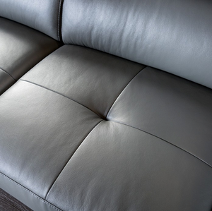 Vadso Leather Match Adjustable sectional in Grey